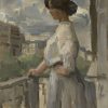 Vrouw op een balkon in Parijs